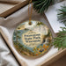 A decorative ornament with a scenic landscape of Potawatomi State Park, Wisconsin, featuring a waterfall and pine trees.
