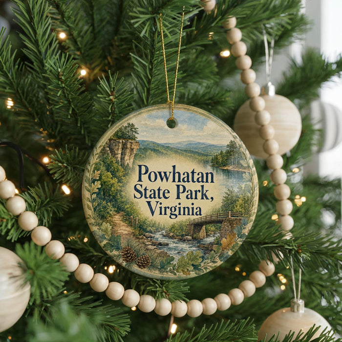 A round ornament hanging on a Christmas tree, featuring a scenic landscape of Powhatan State Park, Virginia.