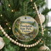 A round ornament hanging on a Christmas tree, featuring a scenic landscape of Powhatan State Park, Virginia.