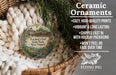 Ceramic ornaments, specifically a round ornament with a castle and trees, are displayed in a basket.