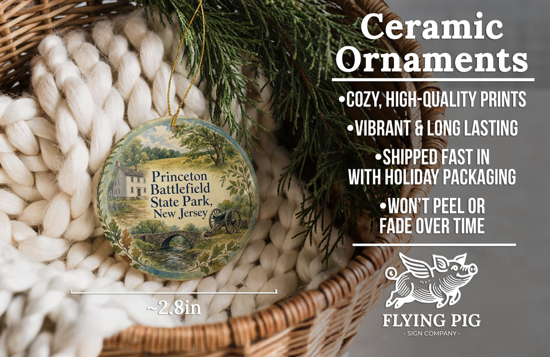Ceramic ornaments, featuring a round ornament with a scenic landscape of Princeton Battlefield State Park, New Jersey, hanging from a wicker basket.
