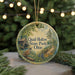 A round ornament with a painting of Quail Hollow State Park, Ohio, featuring a bird perched on a tree branch and a cabin in the background.