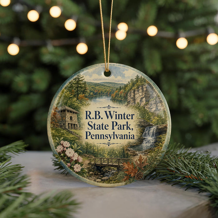 A round ornament with a scenic image of R.B. Winter State Park, Pennsylvania, featuring a waterfall, bridge, and trees.