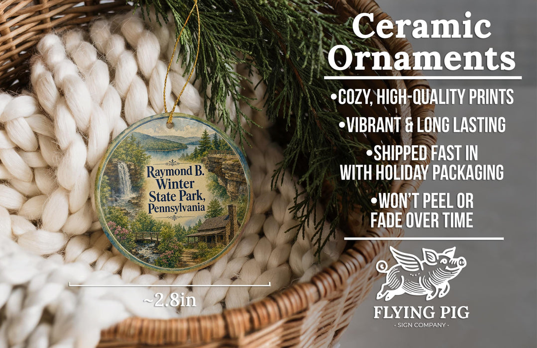 Ceramic ornaments, featuring a scenic image of Raymond B. Winter State Park, Pennsylvania, hanging from a wicker basket.