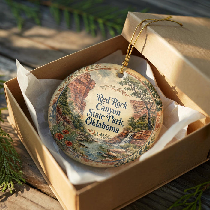 A decorative ornament in a wooden box, featuring a scenic image of the Red Rock Canyon State Park in Oklahoma.