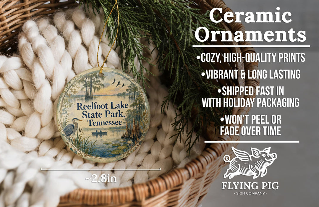 Ceramic ornaments, featuring a round ornament with a scenic image of Reelfoot Lake State Park, Tennessee, hanging from a wicker basket.
