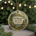 A round ornament with a scenic image of Rib Mountain State Park, Wisconsin, hanging from a string.