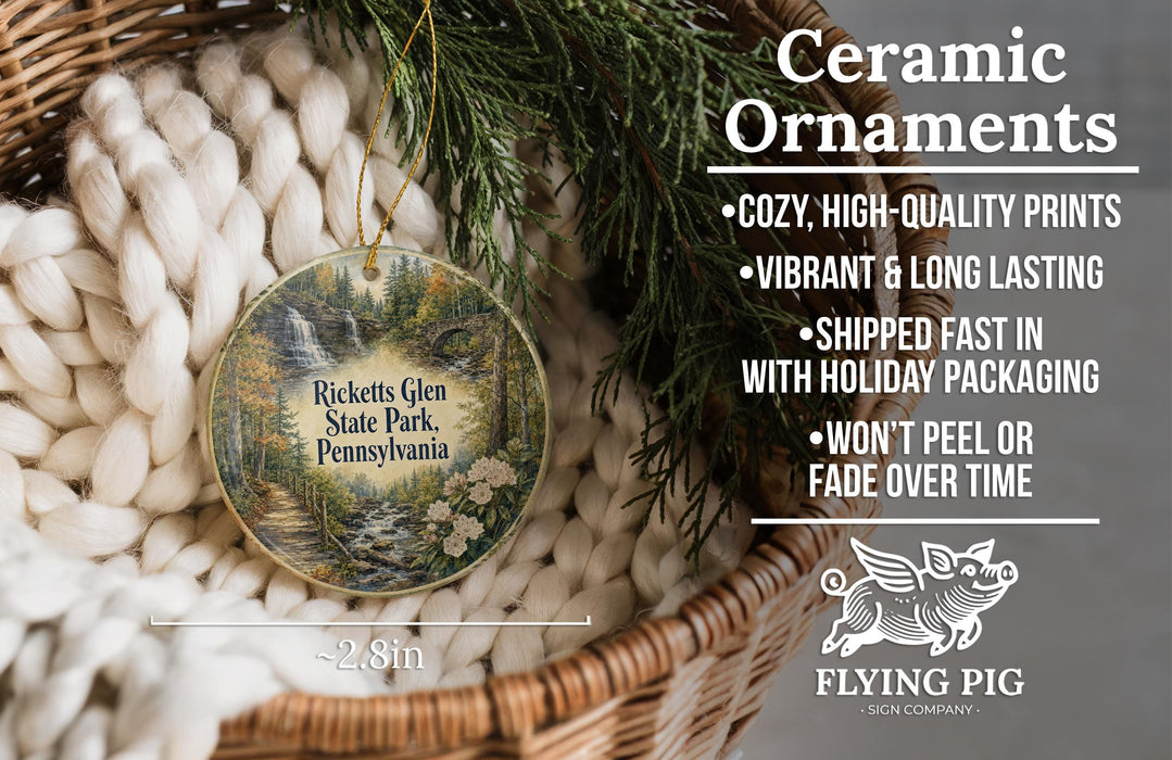 Ceramic ornaments, featuring a nature scene with a waterfall and pine trees, are displayed in a basket.