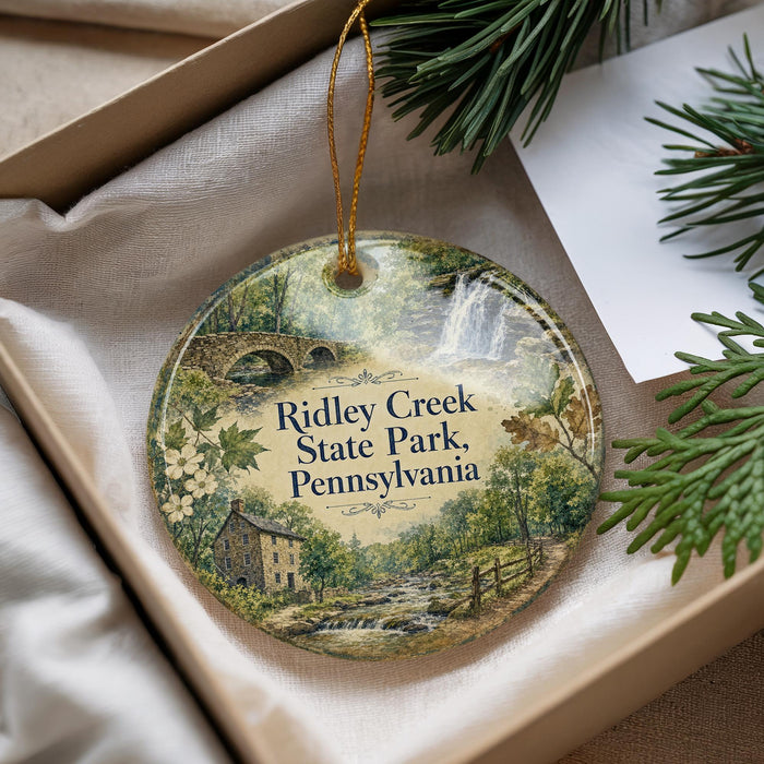 A decorative ornament with a scenic image of Ridley Creek State Park, Pennsylvania, hanging from a string.
