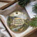 A decorative ornament with a scenic landscape of a river, mountains, and pine trees, featuring the text "Riverside State Park, Washington".