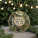 A round ornament with a scenic image of Robert H. Treman State Park, New York, hanging from a string.