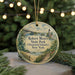 A round ornament with a scenic image of Robert Moses State Park (Thousand Islands), New York, hanging from a string.
