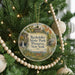 A round ornament on a Christmas tree, featuring an illustration of a deer in a forest setting and the text "Rockefeller State Park Preserve New York".