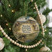 A Christmas tree ornament featuring a scenic image of the Rosebud Battlefield State Park in Montana.
