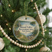 A round ornament on a Christmas tree, featuring a scenic landscape with a lake, mountains, and a sign that reads "Round Valley Recreation Area, New Jersey".