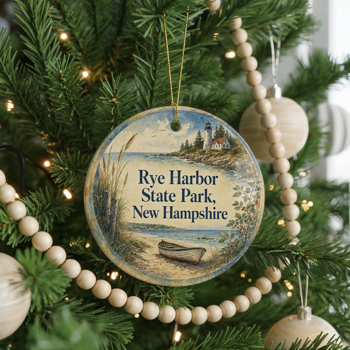 A round ornament hanging on a Christmas tree, featuring a lighthouse and a boat on the water.