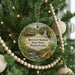 A round ornament hanging on a Christmas tree, featuring a scenic image of Ryserson Station State Park, Pennsylvania.
