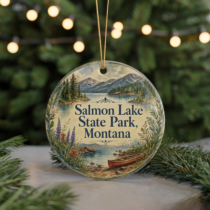 A round ornament with a scenic landscape of mountains, trees, and a lake, featuring the text "Salmon Lake State Park, Montana" on it.