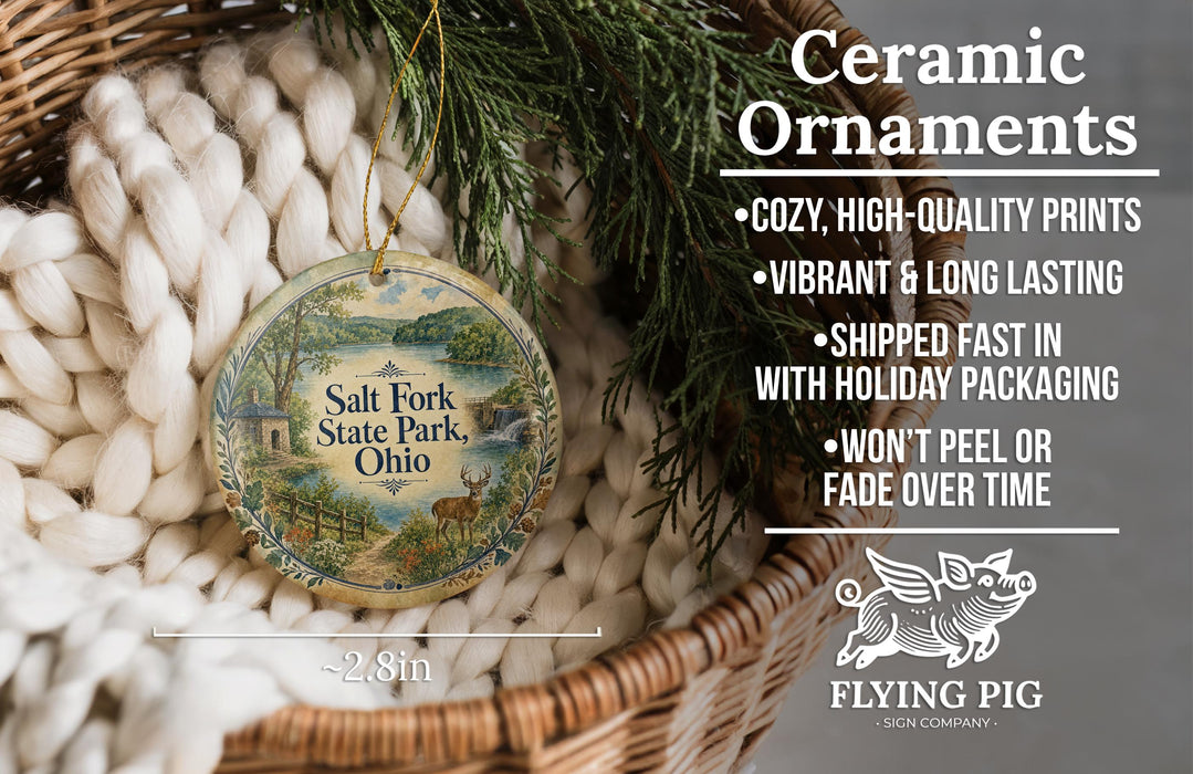 Ceramic ornaments, featuring a round ornament with a scenic image of Salt Fork State Park, Ohio, hanging from a wicker basket.