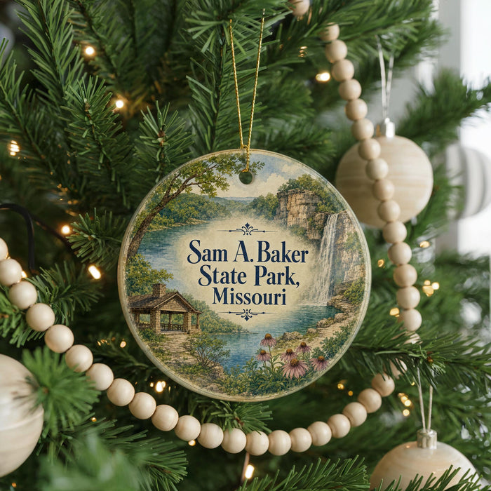 A Christmas tree decorated with ornaments, including a circular ornament with a scenic image of Sam A. Baker State Park, Missouri.