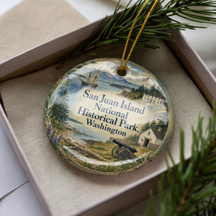 A decorative ornament in a box, featuring a scenic image of San Juan Island National Historical Park in Washington.