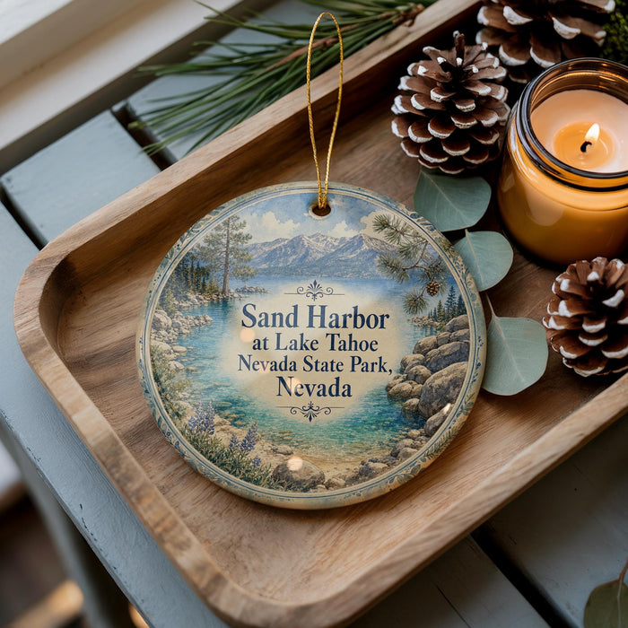 A decorative ornament with a scenic image of Lake Tahoe and Nevada State Park, featuring pine cones and a candle on a wooden tray.