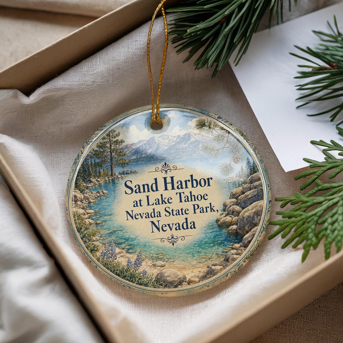 A decorative ornament with a scenic image of Sand Harbor at Lake Tahoe, Nevada, surrounded by pine trees and mountains.