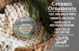 Ceramic ornaments, featuring a scenic image of Sand Harbor at Lake Tahoe, Nevada, are displayed in a wicker basket.