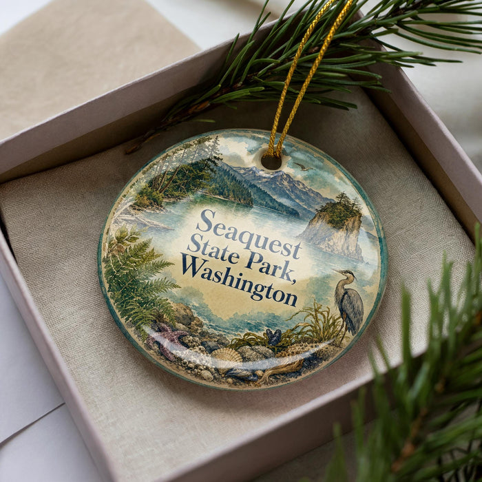 A decorative ornament with a scenic landscape of Sequest State Park, Washington, featuring a bird and mountains in the background.
