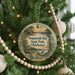 A Christmas tree decorated with ornaments, including a circular ornament with a scenic view of Sequoyah Bay State Park, Oklahoma.
