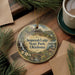 A decorative ornament featuring a scenic image of Sequoyah Lodge in Oklahoma State Park, with pine branches and a cup of coffee nearby.