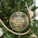 A round ornament hanging on a Christmas tree, featuring a scenic image of Sesquicentennial State Park, South Carolina.