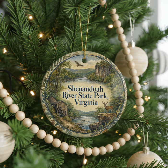 A round ornament hanging on a Christmas tree, featuring a scenic image of Shenandoah River State Park, Virginia.