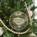 A round ornament hanging on a Christmas tree, featuring a scenic image of Shenandoah River State Park, Virginia.