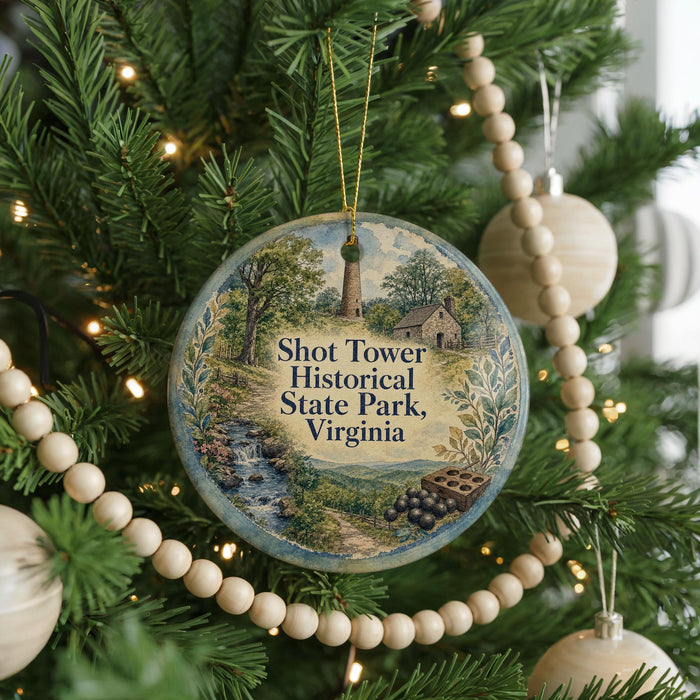 A round ornament on a Christmas tree, featuring a scenic image of Shot Tower Historical State Park, Virginia.