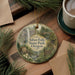 A round ornament with a scenic image of Silver Falls State Park, Oregon, featuring a waterfall, forest, and a sign indicating the location.