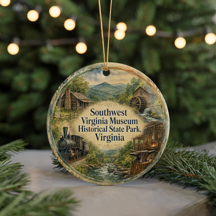 A decorative ornament featuring a scenic image of a historical state park, with a train and other elements, hanging from a string.