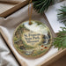 A decorative ornament with a scenic image of St. Francois State Park, Missouri, hanging from a string.