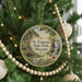 A round ornament hanging on a Christmas tree, featuring a scenic image of St. Francois State Park, Missouri.