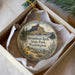 A decorative ornament in a white box, featuring an illustration of Steamboat Rock State Park in Washington.