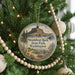 A round ornament on a Christmas tree, featuring a scenic image of Steamboat Rock State Park in Washington.