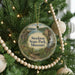 A round ornament hanging on a Christmas tree, featuring a scenic image of Stockton State Park, Missouri.
