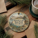 A round ornament with a scenic landscape of Storr Lake State Park, New Mexico, featuring a bird and a lake.