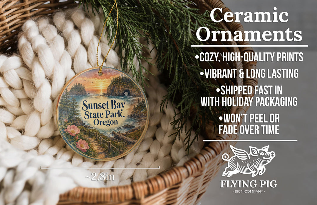 Ceramic ornaments, featuring a sunset scene from Sunset Bay State Park, Oregon, hanging in a woven basket.