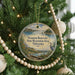 A round ornament hanging on a Christmas tree, featuring a scenic landscape of the Swanson Reservoir State Recreation Area in Nebraska.