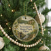 A round ornament hanging on a Christmas tree, featuring a scenic image of Sycamore State Park, Ohio.