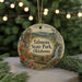 A circular ornament with a scenic landscape of Talimanena State Park, Oklahoma, featuring a waterfall, mountains, and fall foliage.