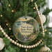 A round ornament hanging on a Christmas tree, featuring a scenic image of Tim's Ford State Park, Tennessee.
