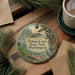 A round ornament with a scenic landscape of a lake and trees, featuring the text "Triton Cove State Park, Washington".