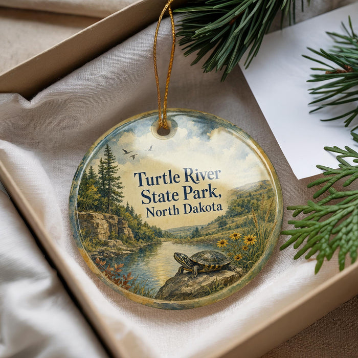 A decorative ornament with a turtle and a scenic landscape, featuring the words "Turtle River State Park, North Dakota" on it.